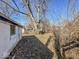The side of the detached garage in a large private backyard at 3751 N Sadlier Dr, Indianapolis, IN 46226
