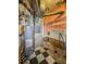 A view of the basement featuring the water heater and shelving at 3751 N Sadlier Dr, Indianapolis, IN 46226