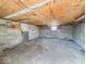 Unfinished basement with concrete walls and floor, wood ceiling, and small window at 3751 N Sadlier Dr, Indianapolis, IN 46226