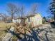 View of home with natural light, a deck, a driveway and lawn at 3751 N Sadlier Dr, Indianapolis, IN 46226