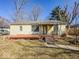 Cozy single story home featuring a covered front porch with ample windows for natural light at 3751 N Sadlier Dr, Indianapolis, IN 46226