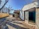 Exterior with garage in an unkept backyard space at 3751 N Sadlier Dr, Indianapolis, IN 46226