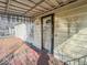 Front porch area with wood decking and a glass front door with the house number 3751 at 3751 N Sadlier Dr, Indianapolis, IN 46226