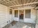 Covered patio area with concrete floor, siding, and a screen door at 3751 N Sadlier Dr, Indianapolis, IN 46226