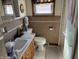 Compact bathroom featuring a vanity sink, toilet, and shower stall at 424 Wayside Dr, Plainfield, IN 46168