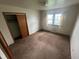 Comfortable bedroom with natural light, closet, and neutral carpeting at 424 Wayside Dr, Plainfield, IN 46168