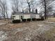 Charming cottage-style home with a well-maintained yard and traditional design elements at 4534 N State Road 9, Anderson, IN 46012