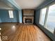 Living room features a stone fireplace and hardwood flooring at 4534 N State Road 9, Anderson, IN 46012