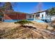 Expansive backyard featuring a mix of brick and siding exterior, deck, and tiered flower beds for outdoor enjoyment at 493 N Avon Ave, Avon, IN 46123
