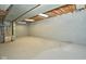 The unfinished basement offers a blank canvas, with bright lights and cement walls at 493 N Avon Ave, Avon, IN 46123