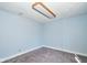 This simple bedroom offers cozy carpeting and calming light blue walls at 493 N Avon Ave, Avon, IN 46123