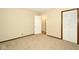 A bright bedroom with beige carpet, neutral walls, and white doors and trim at 493 N Avon Ave, Avon, IN 46123