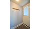 A functional entryway with coat hooks and natural light from the front door window at 493 N Avon Ave, Avon, IN 46123