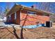 A charming single-story home features a red brick exterior, and professionally landscaped backyard at 493 N Avon Ave, Avon, IN 46123