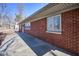 This exterior features a long, paved walkway and a brick outer wall with bright, natural sunlight at 493 N Avon Ave, Avon, IN 46123