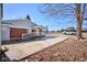 Charming home exterior featuring brick accents, a well-manicured lawn and a lengthy driveway at 493 N Avon Ave, Avon, IN 46123