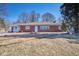 Charming single story home with brick facade, a well-maintained lawn, and mature trees at 493 N Avon Ave, Avon, IN 46123