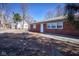 Charming single-story brick home with a well-maintained lawn, walkway and mature trees offering curb appeal at 493 N Avon Ave, Avon, IN 46123
