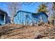The exterior of the detached garage in the backyard is painted a blue color at 493 N Avon Ave, Avon, IN 46123