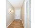 A bright hallway with modern lighting, wood-look floors, and neutral paint at 493 N Avon Ave, Avon, IN 46123