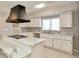 Bright kitchen with marble countertops, white cabinets, and modern appliances at 493 N Avon Ave, Avon, IN 46123
