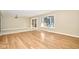 Sun-drenched living room with wood-look floors and a sliding glass door at 493 N Avon Ave, Avon, IN 46123