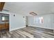 Bright living room with modern gray floors and a view of the bathroom at 493 N Avon Ave, Avon, IN 46123