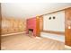 Inviting living room boasts a charming red brick fireplace and light hardwood flooring at 493 N Avon Ave, Avon, IN 46123