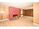 Inviting living room boasts a charming red brick fireplace and light hardwood flooring at 493 N Avon Ave, Avon, IN 46123