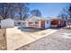 Home exterior with spacious driveway leading to the detached garage in rear at 493 N Avon Ave, Avon, IN 46123