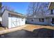 Exterior view of a shed located on the property, with matching vinyl siding and a concrete slab at 493 N Avon Ave, Avon, IN 46123