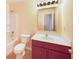 Bathroom with combination tub/shower, toilet, vanity with mirror, and cosmetic lighting at 4943 Dunlin Dr, Indianapolis, IN 46235