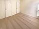 Bedroom features neutral carpet, white walls, and two closets at 4943 Dunlin Dr, Indianapolis, IN 46235