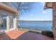 Brick patio overlooking a serene lake view with a glimpse of boat docks on a sunny day at 5004 Boardwalk Pl, Indianapolis, IN 46220