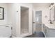 Contemporary bathroom featuring a tiled walk-in shower, white cabinets, and modern fixtures at 5004 Boardwalk Pl, Indianapolis, IN 46220