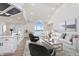 Bright living room featuring vaulted ceilings, a view of the water, and an open layout connecting the kitchen at 5004 Boardwalk Pl, Indianapolis, IN 46220