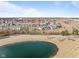 Aerial view of the house from above the pond, highlighting the neighborhood at 553 Farnham Dr, Westfield, IN 46074