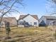 View of the home's backyard with a deck, patio and small lawn at 553 Farnham Dr, Westfield, IN 46074