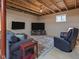 Unfinished basement featuring a seating area with large-screen TVs and natural lighting at 553 Farnham Dr, Westfield, IN 46074