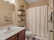 Bathroom featuring a wood vanity, marble countertop, and decorative wall shelving at 553 Farnham Dr, Westfield, IN 46074