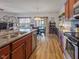 Open kitchen and dining area featuring stainless steel appliances and stylish decor at 553 Farnham Dr, Westfield, IN 46074