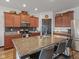 A kitchen with stainless steel appliances, granite counters and a large island with seating at 553 Farnham Dr, Westfield, IN 46074