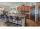 Well-lit kitchen featuring granite counters, a center island, and dark wood cabinets at 553 Farnham Dr, Westfield, IN 46074