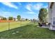 Lush backyard with a cozy seating area, ideal for enjoying the outdoors and entertaining guests at 5772 Jamestown Square Ln, Indianapolis, IN 46234