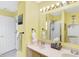 Bathroom featuring a double vanity with a shower and white door at 5772 Jamestown Square Ln, Indianapolis, IN 46234