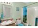 Charming bathroom with a shower-tub combo and soft lighting, paired with vibrant decorations at 5772 Jamestown Square Ln, Indianapolis, IN 46234