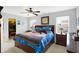 Bedroom featuring a ceiling fan, unique bedding, and a convenient walk-in closet at 5772 Jamestown Square Ln, Indianapolis, IN 46234