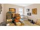 Bedroom with neutral walls and shelving and a sun-filled window view that brings in ample natural light at 5772 Jamestown Square Ln, Indianapolis, IN 46234
