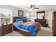 Bedroom with a ceiling fan, wooden furniture, and a bright, cheery ambiance at 5772 Jamestown Square Ln, Indianapolis, IN 46234