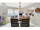 The dining area features lots of sunlight and a view to the kitchen at 5772 Jamestown Square Ln, Indianapolis, IN 46234